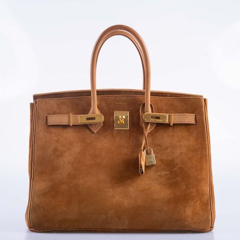 This rare vintage Birkin is a luxurious masterpiece that speaks volumes of refined elegance and unique texture. Crafted from sumptuous Doblis suede, this bag exudes a soft, velvety touch that is both visually appealing and delightful to hold. The Fauve color, a rich and warm hazelnut brown, adds a depth of sophistication and earthy charm to the bag’s appearance. Complementing the suede’s luxurious texture is the Nubuck trim, which provides a subtle contrast with its slightly smoother finish, this material is also used to line the bag. The gold hardware on this Birkin adds a classic touch of glamour, creating a beautiful harmony with the bag's earthy tones. Given its vintage from 1997, this Birkin is not just a fashion statement but a piece of Hermes history, showcasing the brand’s timeless Rare Hermes Bags, Suede Birkin, Hermes History, Brown Birkin, Vintage Birkin, Vintage Hermes Bag, Vintage Kelly, Hermes Birkin 35, Timeless Bags