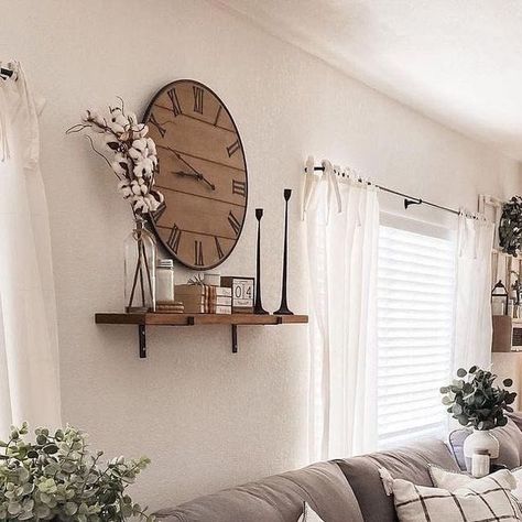 Farmhouse Is My Style on Instagram: "The heart of farmhouse charm 🌾🏡 is perfectly captured in this cozy living space! The neutral tones create a soothing atmosphere, while the mix of textures adds a touch of rustic elegance. The large clock 🕰️ and the delicate greenery 🌿 bring a fresh, inviting vibe. This is the ideal spot to relax and unwind after a long day. (Photo Credit: @amadadecor)

#FarmhouseStyle #CozyLiving #RusticCharm #NeutralDecor #HomeSweetHome" Clock Above Tv, Big Wall Clock Decor Ideas, Clock Wall Decor Layout, Big Wall Clocks Living Rooms, Wall With Clock, Large Clock Decor, Wall Clock Decor Ideas, Clock Decor Ideas, Big Wall Clocks