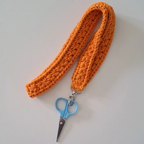 Crochet Lanyard Pattern    This pattern can be adapted to make wristlets and smaller key fobs too.  You will need to work in multiples of 2 to make your initial chain to the length you require.    I chain 138 to get my preferred lanyard length.    I also find using a cotton really brings out the lovely texture in this stitch and doesn’t overstretch too much once in use.      Ch138    Row 1: Hook into second Ch on your hook, yarn over and pull through so you have 2 loops on your hook. Hook into next Ch, yarn Crochet Keychain Lanyard, Crochet Lanyard Pattern, Crochet Lanyards, Crochet Star Keychain, Crochet Keychain Patterns, Crochet Keychain Ideas, Crochet Lanyard, Cotton Crochet Patterns, Wristlet Patterns