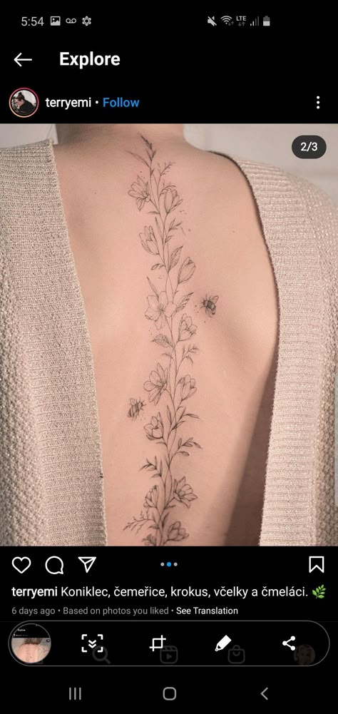 December Flower Spine Tattoo, Nature Inspired Spine Tattoo, Violet Back Tattoo, Violet Flower Spine Tattoo, Dainty Floral Spine Tattoos For Women, Foliage Spine Tattoo, Morning Glory Spine Tattoo, Violet Spine Tattoo, Flower Vine Spine Tattoo