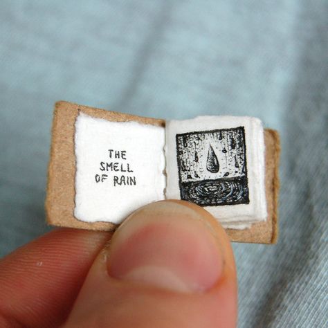 “I started making tiny books because I was getting frustrated at the time it took me to draw larger, highly-detailed images,” Lorenzen tells BuzzFeed Life. | These Impossibly Tiny Books Will Make You Feel Things The Smell Of Rain, Smell Of Rain, Small Book, Small Drawings, Mini Journal, Miniature Books, Handmade Books, Book Binding, Altered Books