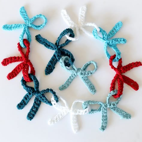 Crochet Bow Garland (with giveaway!) - Sugar Bee Crafts Crochet House Garland, Crochet Bows Garland, Crochet Winter Garland Pattern Free, Crochet Ribbon Garland, Bow Crochet Garland, Crochet Hanging Garland, Bow Garland Crochet, Crochet Bow Garland Free Pattern, Crochet Birthday Decorations