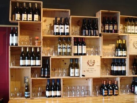 Love this random shelving made from wine crates.  Think about those cool old cigar boxes for this too! Wooden Crates On Wall, Crates On Wall, Wine Box Shelves, Wine Crate Diy, Wine Crate Storage, Wine Crate Shelf, Crate Wall, Red Canary, Crate Bar