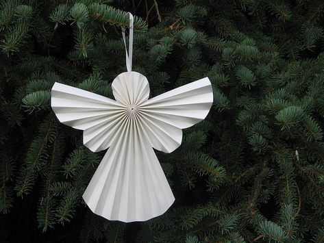 pleated paper angel decoration by love it want it buy it | notonthehighstreet.com Paper Angels Diy, Angel Ornaments Diy, Diy Christmas Angel Ornaments, Recycled Christmas Decorations, Diy Paper Christmas Tree, Christmas Angel Decorations, Diy Angels, Paper Angel, Paper Christmas Decorations