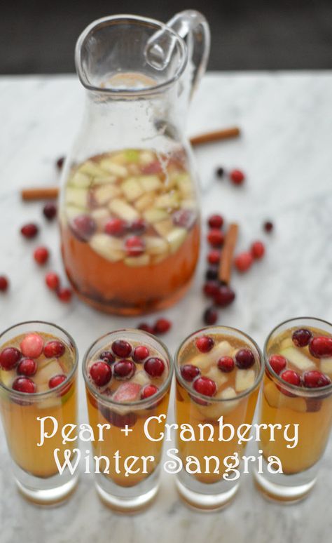 Pear + Cranberry Winter Sangria Holiday Sangria Recipes, Cranberry Sangria, Winter Sangria, Holiday Sangria, Christmas Sangria, Cider Sangria, Sangria Recipe, Festive Drinks, Sangria Recipes