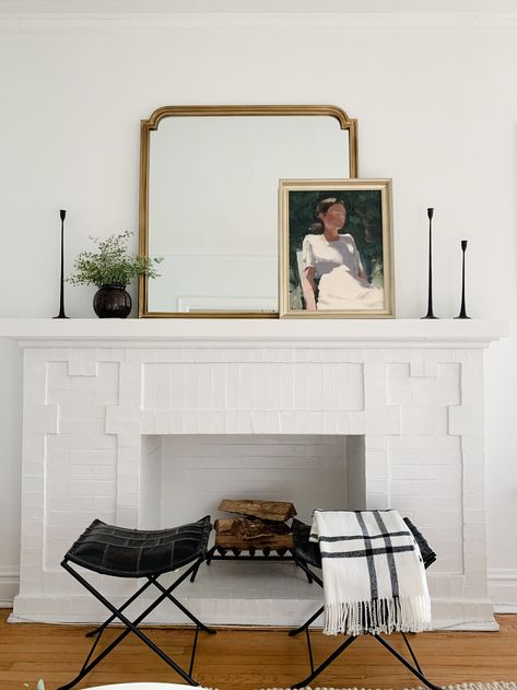 Mantle Decor Transitional, Mirror And Art On Mantle, Art Leaning On Mantle, Classic Mantel Decor, Modern Mantle Styling, Amber Interiors Fireplace Mantle, Scandinavian Fireplace Mantel, White Vintage Fireplace, Mantle Mirror Black