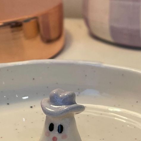 Beth ✨ on Instagram: "I love how this little cowboy trinket dish turned out 🥹💜 #ghost #ghosttrinkets #trinketdish #claytrinketdish #clay #clayart #ceramics #pottery #handmadeart #pintrestart #pintrestaesthetic #falltok #falldecor #autumb #fall #halloween #ghosts #cuteghosts #potterygirl #potterypainting #claytutorial #cowprint #cowboy #cowboyghost #handmadecrafts #craftideas #cowboyhat #feather #explorepage #trendingsound" Ghost Trinket Dish, Ceramic Butter Dish, Little Cowboy, Clay Art Projects, Ceramics Pottery, Clay Tutorials, Pottery Painting, Trinket Dish, Halloween Ghosts