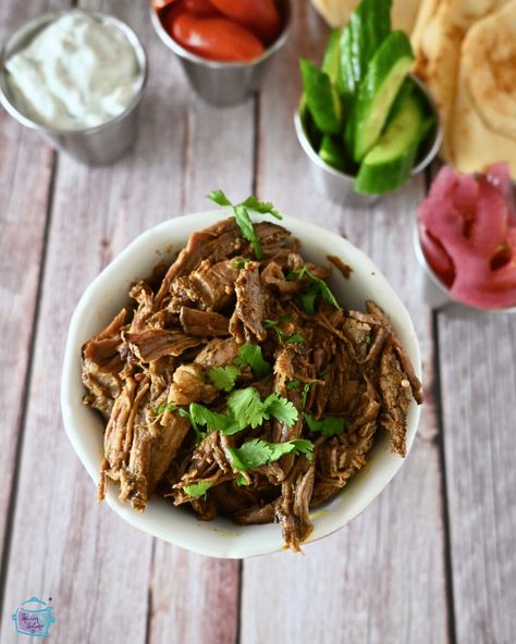 Immerse yourself in the flavors of the Middle East with this easy slow cooker shredded beef shawarma! Marinated in aromatic spices and slow-cooked to tender perfection, this recipe is perfect for a flavorful and fuss-free meal. Serve it on pita bread with your favorite toppings for a taste of authentic shawarma right at home. Beef Shawarma, Slow Cooker Shredded Beef, Shawarma Seasoning, Shawarma Recipe, Chicken Gyros, Middle Eastern Dishes, Chicken Shawarma, Crockpot Dishes, Shredded Beef