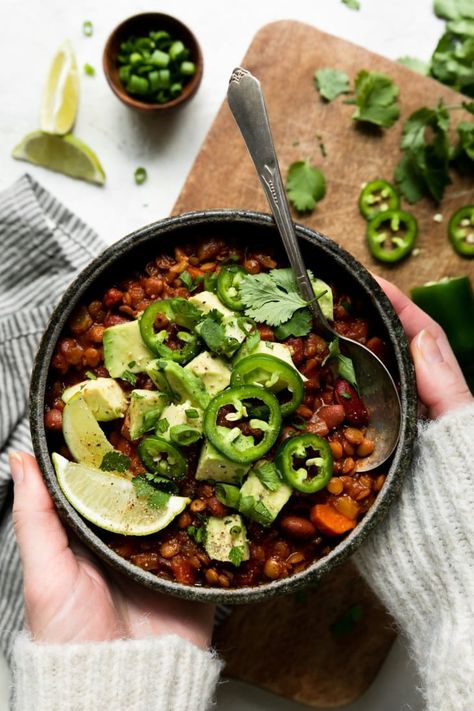 A delicious and entirely plant-based vegan chili that requires just a little prep time and is easy on the budget thanks to budget-friendly staples like canned tomatoes, dried lentils, and canned beans. A gluten-free and vegan lentil chili recipe worth making! Chili With Lentils, Slow Cooker Vegan Chili, Lentil Chili Recipe, Slow Cooker Vegan, Lentils Recipe, Vegan Chili Recipe, Lentil Chili, Roasted Radishes, Dried Lentils