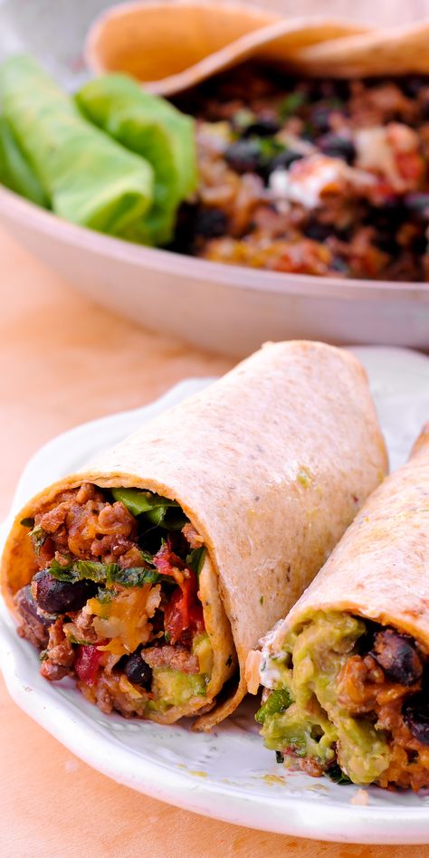 All-time favorite beef burrito recipe! #beef #burrito #garlic #tacoseasoning #blackbeans #tortillas #rice #cheddar #guacamole #sourcream #lettuce #tomato #onion Ingredients: ground beef 1/2 onion chopped salt to taste 1 teaspoon garlic powder 2 teaspoons taco seasoning 1/4 cup beef broth 15 oz. black beans (1 can) Fillings: 8 large 10-inch flour tortillas 1 cup cooked rice 2 cups shredded cheddar cheese Guacamole Sour cream 2 tomatoes chopped Lettuce chopped Beef And Potato Burrito Recipe, Potato Burrito Recipe, Ground Beef Burritos, Burritos Beef, Beef Burrito Recipe, Best Burrito, Indian Bread Recipes, Beef Burrito, Burrito Recipe