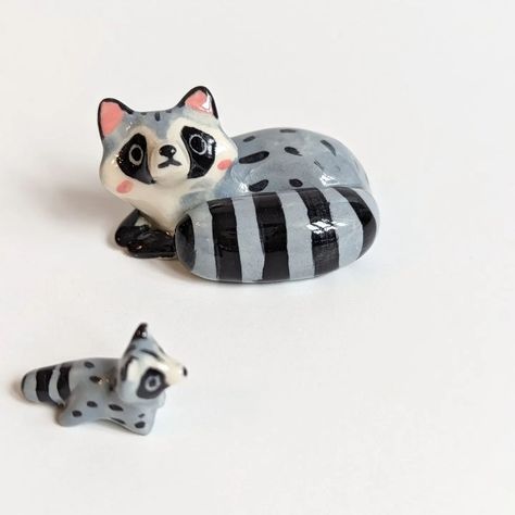 Raccoon mama and her mini-me This figurine set is available now :) #raccoonlove #raccoon #holidays #uniquegifts #ooak | Instagram Mini Bead Animals, Weird Trinkets, Small Clay Art, Clay Crafts Animals, Polymer Clay Opossum, Cute Clay Animals, Raccoon Carving, Little Clay Figures, Clay Raccoon