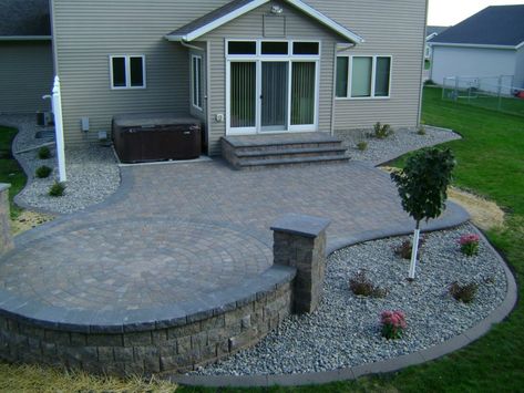 Earth Tone Paver Patio with Sitting Wall and Rock Fill Edging - Oasis Landscapes Patio Step Down To Lawn, Step Down Patio Ideas, Midwest Backyard, Landscaping Around Patio, Sitting Wall, Patio Extension, Paver Patterns, Paver Patios, Plants Landscape