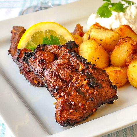 Garlic Balsamic Grilled Lamb Chops. A very simple marinade that pairs very well with the flavour of grilled lamb. Serve with Lemon Herb Roast Potatoes, Lemon Mint Tzatziki and a Greek side salad for an exceptionally delicious meal. #grilling #bbq #barbecue Tzatziki Potatoes, Greek Side Salad, Balsamic Lamb Chops, Lamb Chops Marinade, Grilled Lamb Chop Recipes, Simple Marinade, Garlic Balsamic, Grilled Lamb Chops, Lamb Chop Recipes