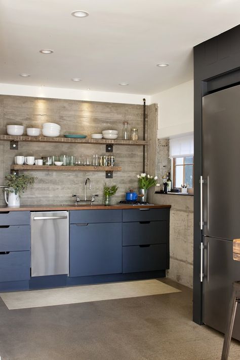 kitchen with open shelves made from 100-year-old floor joists; board formed concrete wall. Kitchen With Concrete Floors, Kitchen Blue Cabinets, Blue Cabinets Kitchen, Concrete Cabinets, Wall Concrete, Kitchen Blue, Blue Kitchen Cabinets, Kitchen Cabinets Decor, Concrete Kitchen