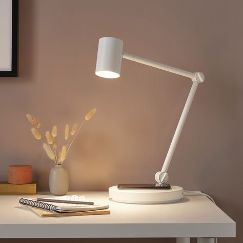 You can easily direct the light where you want it because the lamp arm and head are adjustable. Provides a directed light that is great for reading. You can charge 2 devices at the same time since there is also a USB port built into the lamp. No need to search for lost chargers and untangle messy cords. You can easily charge your smartphone wirelessly. If your phone supports wireless charging, place it on the built-in charger. Ikea Light Bulbs, Ikea Table, Office Lamp, Work Lamp, Ikea Family, Desk Light, Types Of Lighting, Desk Lamps, Led Light Bulb