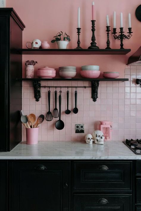 A pink goth kitchen with black cabinetry, gothic decor, and pink accents, creating a playful yet dark aesthetic. Goth Kitchen Ideas, Goth Kitchen Decor, Goth Kitchen, Black Candlesticks, Elegant Goth, Pink Goth, Aesthetic Kitchen, Themed Accessories, Black Cabinets