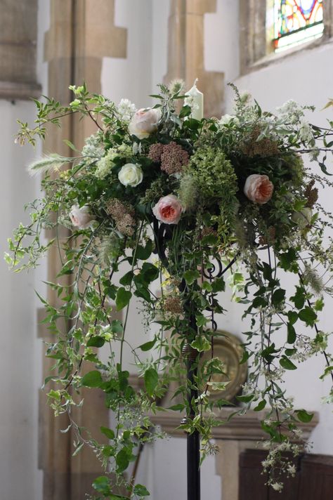 Floral candelabra in church for wedding ceremony Wedding Candelabras Ceremony, Candle Stick Floral Arrangement, Spring Wedding Centerpiece Ideas, Candleabra Wedding, Chapel Flowers, Marquee Flowers, Creepy Wedding, Candelabra Flowers, Country Garden Flowers