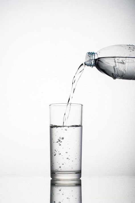 Close-up of pouring water splashing in glass isolated on white background Pouring Water, Water Splashing, Studio Photoshoot Ideas, Naruto Sharingan, Water Images, Glass Photography, Water Drawing, Glass Of Water, Studio Photoshoot