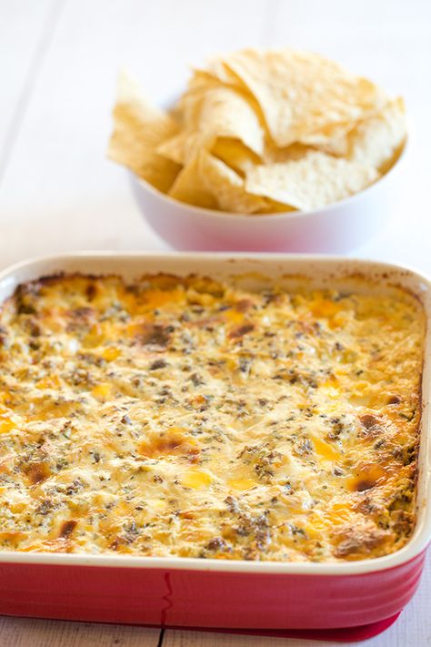 This "Hissy Fit Dip" with the crazy moniker is a HUGE party hit - sausage, cream cheese, sour cream, two cheeses, chives and seasonings make this one absolutely irresistible! | browneyedbaker.com Party Food Savoury, Hissy Fit Dip, Food Savoury, Sausage Cream Cheese, Huge Party, Muenster Cheese, Sage Sausage, Hissy Fit, Dipping Sauces