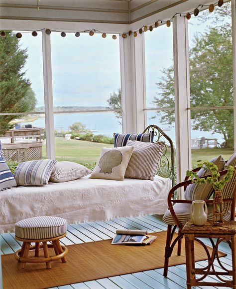 What’s better than a porch by the sea? One outfitted with a hanging bed that’s perfect for sleeping or soaking up a beach read. #porchdecorating #porchideas #frontporchdecor #sleepingporch #southernliving Comfy Cottage, Cottage Rooms, Light Blue Bedding, Antique Iron Beds, Porch Design Ideas, Cottage Room, Cottage Coastal, Sleeping Porch, Hanging Beds