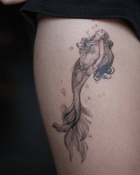 Mermaid tattoo on the thigh. Siren And Moon Tattoo, Mermaid Hip Tattoo, Mermaid Tattoo On Hip, Thigh Mermaid Tattoo, Selkie Tattoo, Swimming Mermaid Tattoo, Mermaid Swimming Down Tattoo, Mermaid Thigh Tattoo, Vintage Mermaid Tattoo