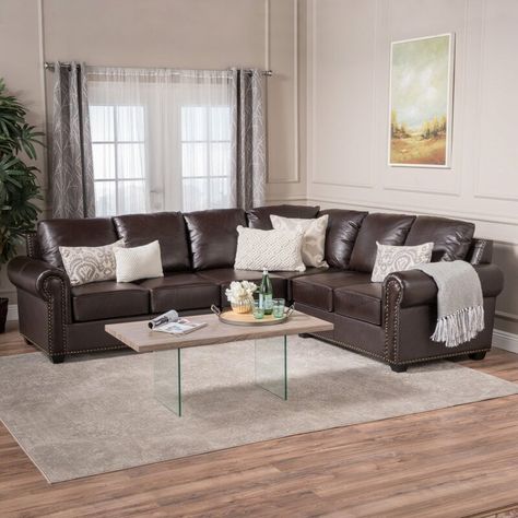 Hanging curtains around windows is a sure way to style up a room, bring in some color, and even make the space look a little bigger. But, it’s a big t... | Metallic Silver #Curtains #BrownSofa #BrownSofaCurtains #CurtainColors #Sofa #LivingRoom #DecoratedLife Relaxed Living Room Decor, Dark Brown Couch Living Room, Curtains To Go, Dark Brown Couch, Brown Leather Couch Living Room, Dark Brown Furniture, Brown Furniture Living Room, Color Curtains, Leather Sectionals