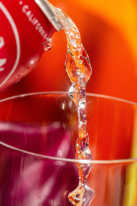 Art Direction, Photography, and Retouching by Weekend Creative. Styling by Jenna Baucke. Backdrops by Studio Cosita. // Beverage photoshoot featuring Ashland Hard Seltzer Tropical Cherry with bright red yellow purple colors. Styled with fruits and florals on a reflective mirror. High contrast and texture. Macro shot of liquid pouring. #foodphotography #beveragephotography #alcoholphotography #canphotoshoot #foodstyling #creativedirection #productphotography #productshoot #advertisingphotography Beverage Photoshoot, Weekend Creative, Commercial Photography Studio, Camera Angles, Photography Resources, Food Photography Inspiration, Cool Electronics, Macro Shots, Hard Seltzer