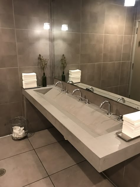 Bathroom Trough Sink Two Faucets, Trough Sink With 2 Faucets, Luxury Public Bathroom, Concrete Double Sink, Commercial Bathroom Sinks, Waterfall House, Bathroom Sink Design, Lavatory Sink, Public Bathrooms