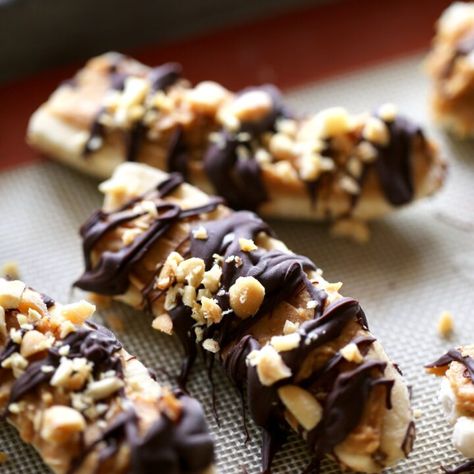 Healthy Frozen Banana Snickers - The Conscientious Eater Banana Snickers, Frozen Banana Treats, Peanut Butter Caramel, Banana Snacks, Roasted Hazelnuts, Banana Treats, Butter Caramel, Frozen Bananas, Hazelnut Spread