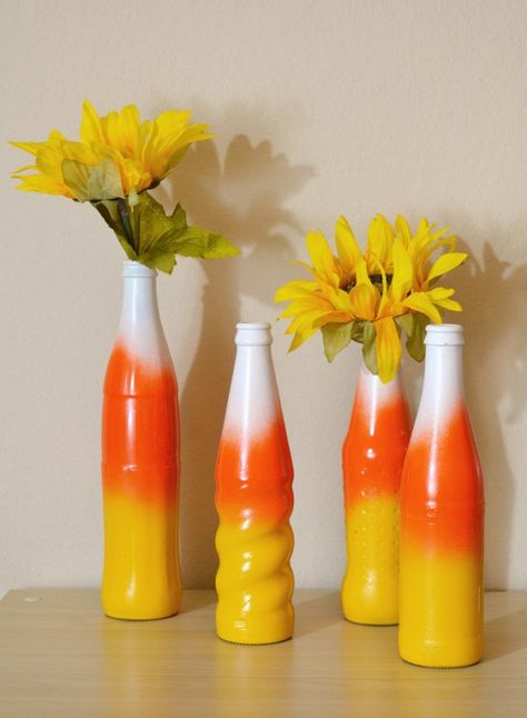 DIY Fall Halloween Candy Corn Bottle Vases Spray Paint Flowers, Spray Painted Bottles, Yellow Spray Paint, Cheap Halloween Decorations, Fall Candy, Homemade Halloween Decorations, Easy Halloween Decorations, Paint Flowers, Halloween Candy Corn