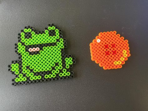 More Perler Bead makes ✨❤️ I got a mini heat press by Cricut and it works so well. Fusing the beads will be much better now! #perlerbeads #beads #crafty #beadcrafts #dragonball #frog Perler Bead Patterns Frogs, Perler Beads Frogs, Cute Frog Perler Bead, Small Frog Perler Bead Pattern, Frog Perler Beads, Perler Bead Frog Earrings, Mini Heat Press, Bead Frog, Melted Beads