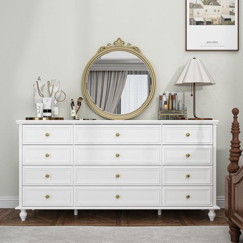 PRICES MAY VARY. [Modern Elegance] Pure white with a sleek modern design, this dresser chest offers a harmonious aesthetic to any living space. Its compact structure and refined texture uphold an elegant atmosphere. [Premium Quality Materials] Crafted from thick MDF panels, sturdy wooden legs effectively support the weight of this 12-drawer dresser, ensuring stability and durability. Golden handles and metal glides enable smooth drawer operation. The surface is polished, wear-resistant, and easy White Chest With Gold Hardware, White A Gold Dresser, Cream Gold Dresser, Dresser With Gold Bed, White And Good Dresser, White Bedroom Furniture With Gold Accents, Cowuette Dresser, White Chalk Paint Dresser With Gold Handles, Golden Furniture Bedrooms