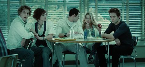 The Cullens are all matching except for Edward — the only one at the table not wearing white for some reason. (Uh, did you not get the memo, Eddy?) Catherine Hardwicke, Twilight 2008, Twilight Photos, The Cullen, Twilight Film, Twilight Pictures, Kellan Lutz, Twilight Fans, Twilight Movie