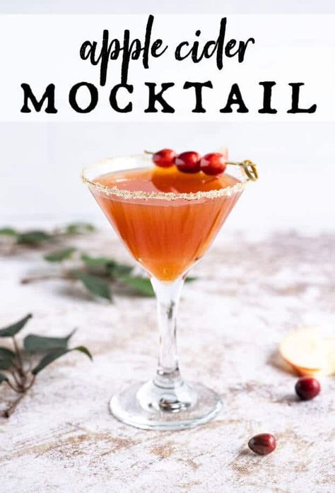 apple cider mocktail in a martini glass rimmed in sugar and garnished with fresh cranberries via @artfrommytable Apple Cider Drinks Nonalcoholic, Christmas Apple Cider, Sangria Mocktail, Apple Cider Martini, Nonalcoholic Party Drinks, Sparkling Apple Cider, Cider Sangria, Apple Cider Sangria, Spicy Drinks