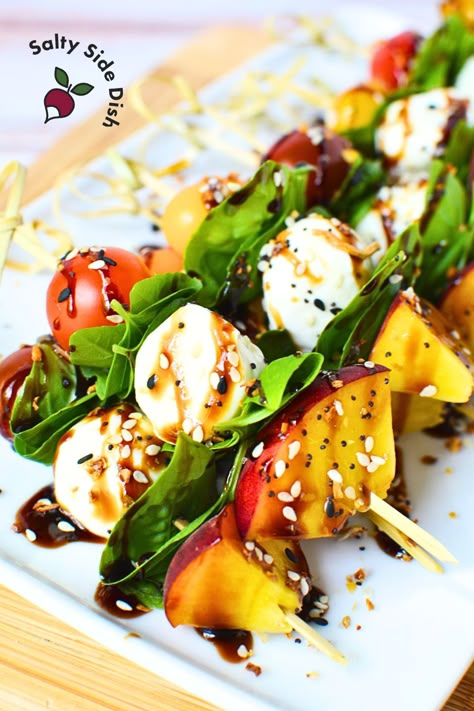 Make fresh Peach Caprese Skewers! Made with grape tomatoes, mozzarella, basil, and juicy peach slices, drizzled with balsamic glaze. Peach Mozzarella Caprese, Peach Caprese Skewers, Tomato Mozzarella Basil Skewers, Accordion Cucumber, Fresh Mozzarella Appetizers, Peach Skewers, Caviar Dip Recipe, Spiral Cucumber Salad, Peach Mozzarella