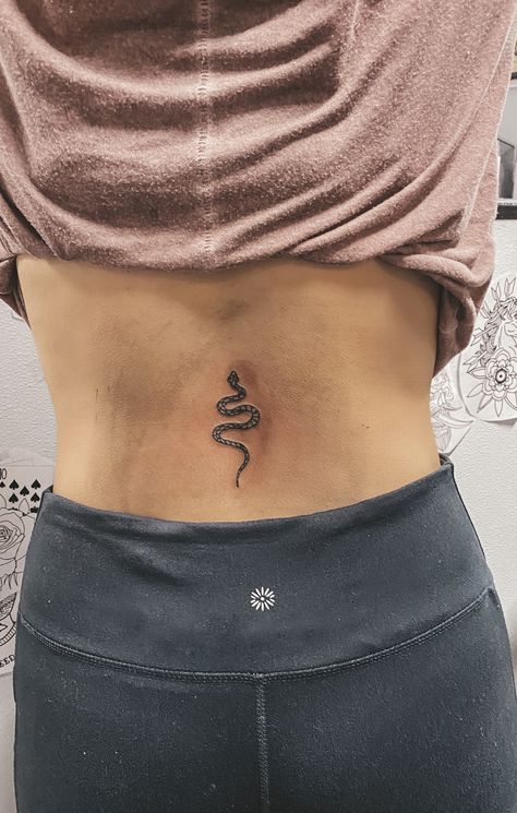 Snake Tattoos On Back, Tattoo About Growth, Snake Tattoo Back, Tattoos For Growth And Change, Belly Button Tattoo, Small Snake Tattoo, Button Tattoo, Flower Spine Tattoos, Tattoo Snake