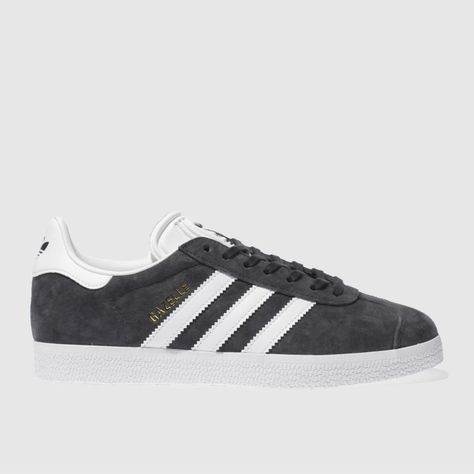 adidas honour one of their most prestigious designs of the '90s as the Gazelle Suede lands at schuh. The iconic dark grey suede profile features gold foil details and authentic trefoil branding at the tongue and heel. A durable rubber sole completes. UPPER: Suede & man-made,LINING: Fabric & man-made,OUTSOLE: Rubbercolour : Dark Grey Product code : 1920727750 Grey Gazelle, Adidas Trainers Women, Adidas Gazelle Grey, Adidas Outfit Women, Trainers Adidas, Adidas Originals Gazelle, Womens Footwear, Grey Trainers, Suede Trainers