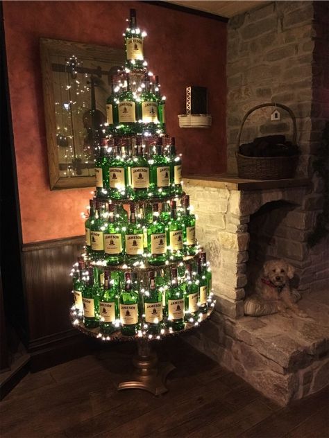 VSCO - Our Jameson Irish Whiskey bottle christmas tree in our Ould Sod Pub!!!!!! Feature our Irish Lucky dog!!!! | katefitz51 Whiskey Bottle Christmas Tree, Christmas Tree For Cabin, Irish Pub Christmas Decor, Christmas Decorations Bar Restaurant, Irish Pub Decor Ideas, Liquor Store Christmas Decorations, Irish Christmas Tree, Pub Christmas Decor, Christmas Pub Decorations