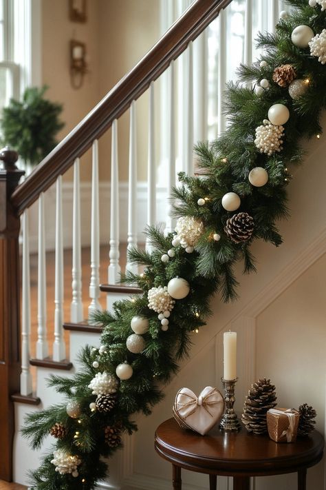 Transform your staircase with this stunning Christmas home decor! Lush greenery and chic ornaments create a cozy holiday vibe. Perfect for adding warmth to your space. #ChristmasHomeDecor #HolidayVibes #FestiveStaircase Stair Christmas Decorating Ideas, Stair Christmas Garland Decoration, Staircase Xmas Decor, Christmas Decor Stairway, Holiday Bannister Ideas, Christmas Ideas For Stairs, Christmas Staircase Garland Ideas, Banister Ideas Christmas, Winter Staircase Decor