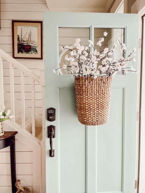 Wall By Front Door Decor, Hanging Flower Baskets Front Door, Floral Baskets For Front Door, Hanging Basket On Front Door, Spring Small Front Porch Decor, Wall Next To Front Door Decor Inside, Basket On Front Door, Front Door Flower Basket, Basket Front Door Decor