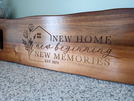 "Welcome Home! 🎉🏡 Make your new home even more special with our custom laser-engraved charcuterie board. Perfect for a housewarming gift or a realtor's closing present. ✨ Personalized with your move-in date ✨ High-quality, durable acaia wood ✨ The perfect addition to any kitchen Order yours today and celebrate your new beginning in style! 🥂 #newhome #housewarminggift #realtorexperience #charcuterieboard #customgifts #homedecor #laserengraved #smallbusiness #veteranowned #womanowned #sainta... Wood Burned Signs, Cnc Router Projects, Laser Engraving Ideas, Router Projects, Engraving Ideas, Laser Projects, New Flat, Blue Steel, New Homeowner