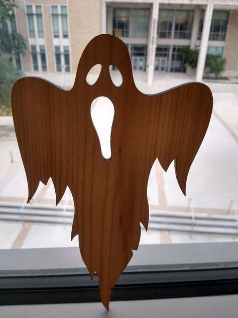 Laser cut from reclaimed cedar, this spooky specter is ready for Halloween.  Hang it on your door or in your window to scare trick-or-treaters.   Put several in your tree to make an old Transylvanian Ghossling.  This accent piece is unpainted so that paint it the way you want, or leave it unpainted and enjoy the wood grain. Plywood Halloween Cutouts, Silhouette Art Ideas Simple, Wood Scroll Saw Projects, Wood Ghosts Diy, Halloween Decorations Wood, Laser Wood Projects, Halloween Wood Cutouts, Wood Halloween Decorations, Wooden Halloween Decorations