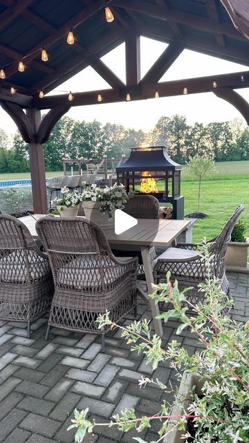 Kirsten Schaefer on Instagram: "Lowe’s making our outdoor dining dreams come true 🤩#ad @loweshomeimprovement 

Lowe’s finds : 
Gazebo
Dining table
Dining chairs
Wood burning firepit 
Supplies to build fireplace hearth
Stain
Large concrete planters 
Dappled willow shrubs and tree
Boxwoods 
Watering can

For any of these items comment SHOP & I’ll message you directly! 

#LowesPartner #LowesProject #backpatio #outdoordining #countryliving #outdoorliving #getoutdoors" Patio Farm Table And Chairs, Round Patio Dining Set, Patio Dining Furniture Overstock, Black Patio Dining Sets, Large Concrete Planters, Big Lots Outdoor Furniture Kitchen & Dining Chairs, Garden Table And Chairs, Fireplace Hearth, Backyard Bbq