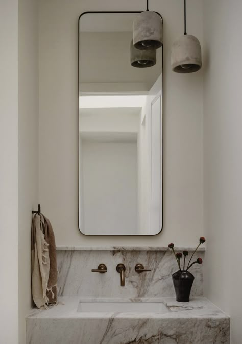 Modern Downstairs Toilet, Masculine Modern Bathroom, Marble Accent Wall Bathroom, Powder Room Neutral, Narrow Small Bathroom, Fancy Powder Room, Dwell Bathroom, Small Marble Bathroom, Portuguese Bathroom