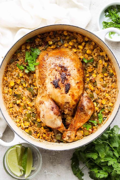 This one pot whole chicken Spanish and rice is the perfect weeknight meal. It's ready in 1 hour and is full of protein and vegetables. Dutch Oven Whole Chicken, Juicy Roasted Chicken, Oven Roasted Whole Chicken, Roast Chicken And Rice, Whole Baked Chicken, Perfect Grilled Chicken, Rice And Veggies, Easy Chicken Marinade, Chicken Over Rice