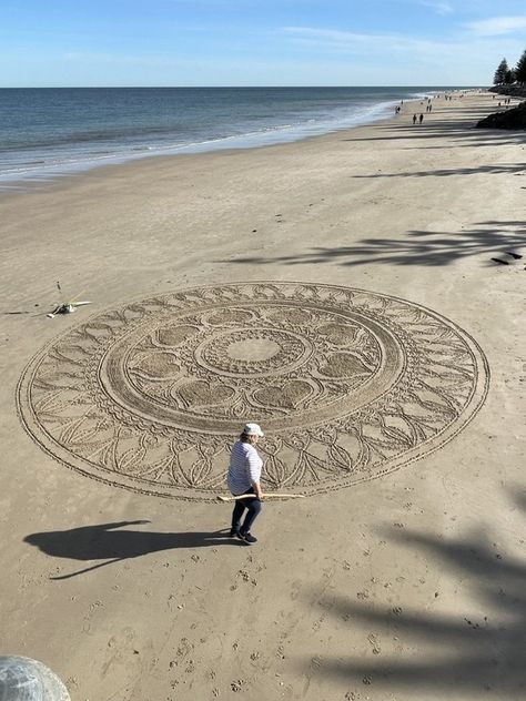 Sue Norman - artist draws these amazing mandalas in the sand at Brighton Beach in South Australia. She uses a broom and a stick. She has a facebook page Sue Norman sand mandalas if you want to see more. #art Sand Art Beach, Sand Mandala Art, Sand Drawings Beach, Sand Writing Beach, Beach Mandala, Sand Mandala, Sand Art Projects, Aboriginal Sand Art, Sand Drawing