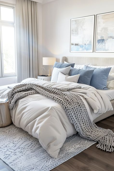 Create a Tranquil Bedroom Oasis: Stylish Decor & Serene Color Palettes Neutral Bedding Blue Accent, Light Blue Walls Gray Bedding, Grey Bed Blue Bedding, Grey And Blue Bedding Ideas, Blue Grey Comforter Bedroom, Blue Gray And Tan Bedroom, Light Grey Guest Bedroom, Bed With Blue Pillows, Dark Blue And Neutral Bedroom