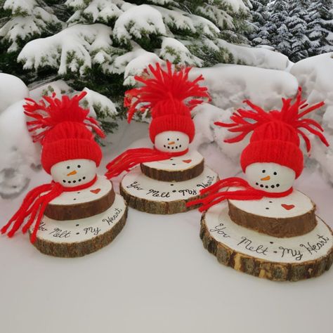 Hurry! Before they melt away. Despite the chilly weather outside, these snowmen are melting with warmth from the holiday season indoors. Each snowman features a unique bottom wood slice, adding to their individual charm while maintaining consistent heights. Adorned with a small red scarf and a matching red tassel cap, every snowman holds a heartfelt red heart engraved with the inscription: 'you melt my heart'. These adorable melting snowmen are the perfect addition to your holiday decor, ideal for snowman enthusiasts and collectors alike. They make delightful gifts for Secret Santa exchanges, grab bags, or as charming stocking stuffers. PLEASE NOTE Due to the nature of these wood slices, there will be some imperfections on the surface of the slice as well as some pieces of bark will fall o Wood Slice Snowman, Christmas Deer Decorations, Snowman Crafts Diy, Melting Snowmen, Diy Stocking Stuffers, Melted Snowman, Wooden Snowman, Snowman Christmas Decorations, Wood Slice Crafts