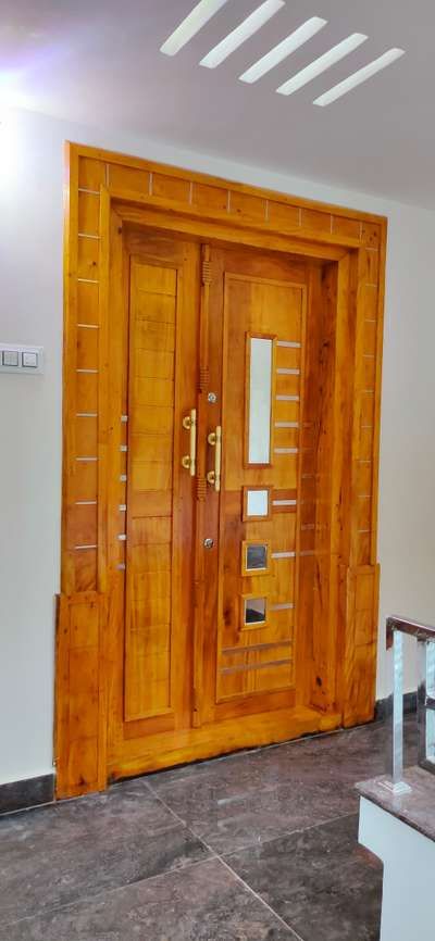 Door Designs by Carpenter Santhosh Santhosh, Thiruvananthapuram | Kolo Kerala Door Design, Latest Wooden Front Door Designs, Latest Door Designs, Plywood Coffee Table, House Front Door Design, Kerala House, Wooden Front Door Design, Doors Design, Door Design Images