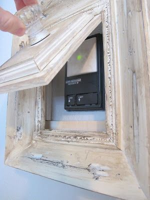 How to turn a picture frame into a gadget to hide your garage door opener. My Uncommon Slice of Suburbia Remodel Farmhouse, Garage Door Opener, Door Opener, Household Hacks, My Dream Home, Thermostat, Home Deco, Home Projects, Home Organization